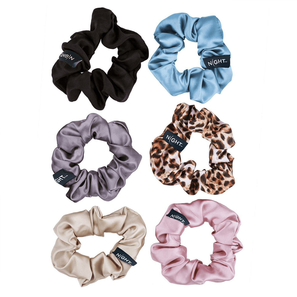limited edition 6 pack of silk scrunchies laid out showing black, sky, gunmetal, leopard, champagne and blush colors