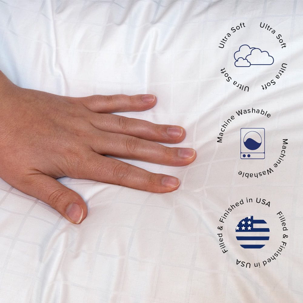 A hand pushing down on a down alternative pillow and showing ultra soft, machine washable, and filled and finished in the USA