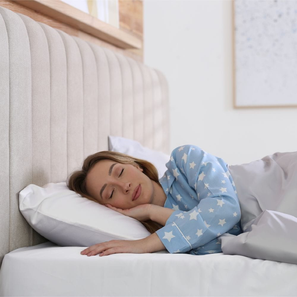 woman sleeping on sheet