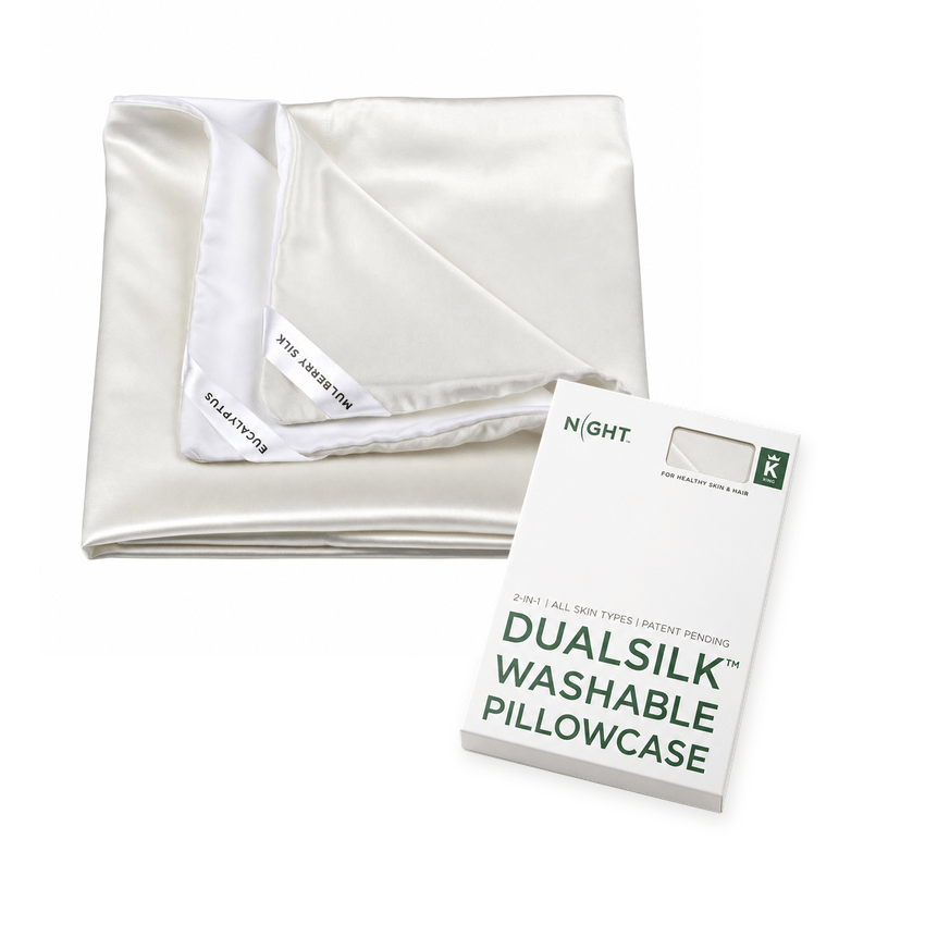 White DualSilk pillowcase folded to show its silk and eucalyptus sides alongside the retail box