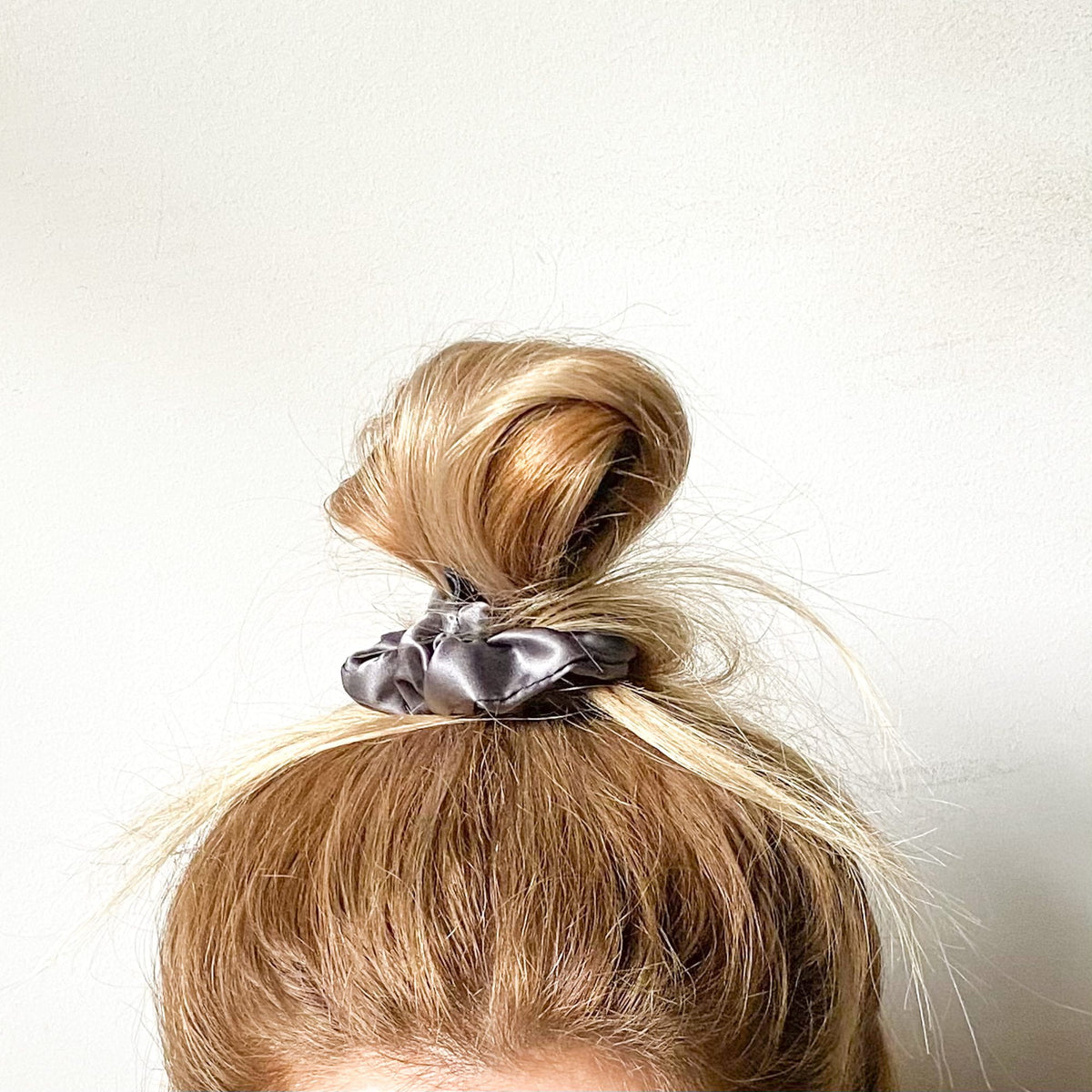 Gunmetal NIGHT Classic silk scrunchie worn around a bun