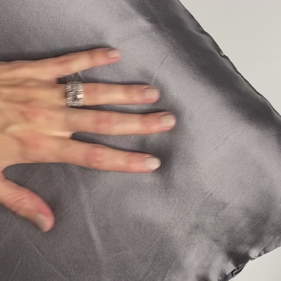 A hand glides across the mulberry silk side of Gunmetal DualSilk in a continuous silent loop
