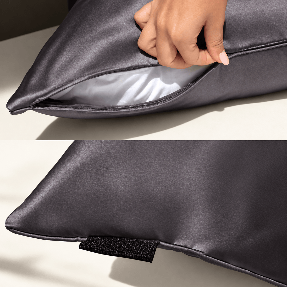 Gunmetal NIGHT silk pillowcase showing its hidden zipper, piping and woven label.