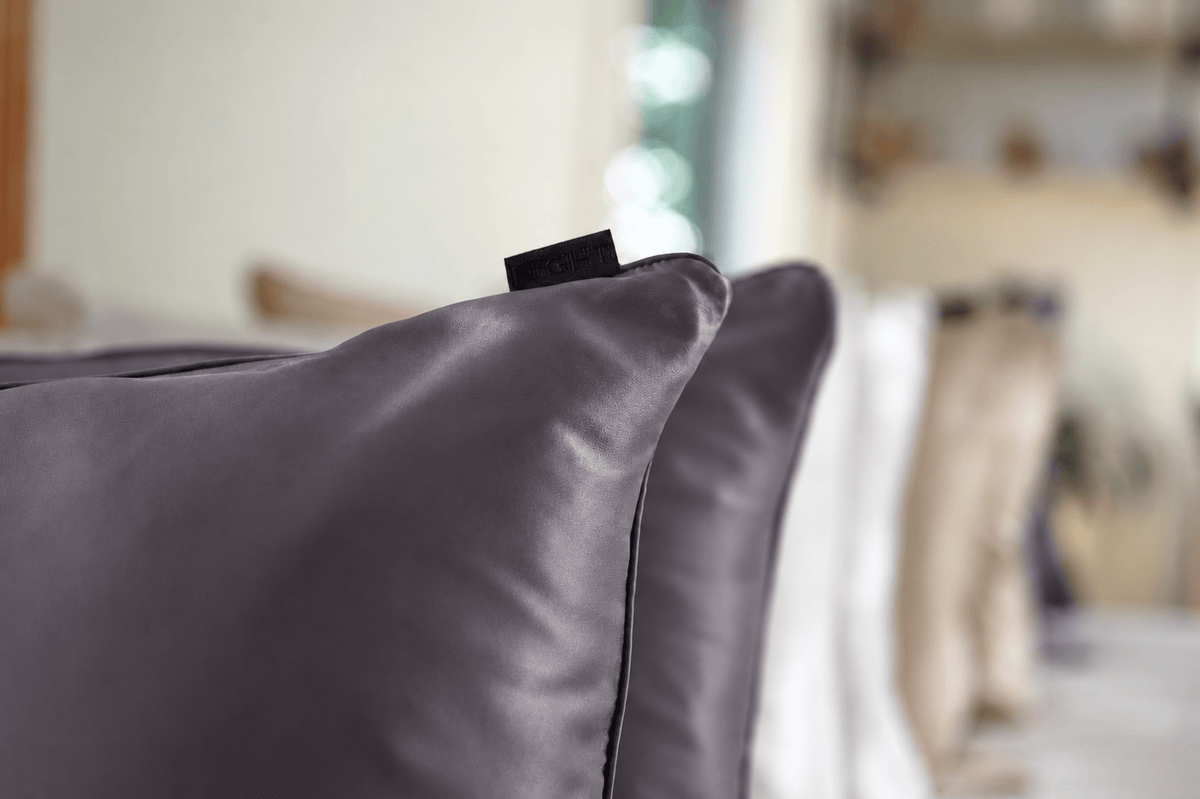 A close view of Gunmetal Mulberry silk, fine piping and the NIGHT woven label.