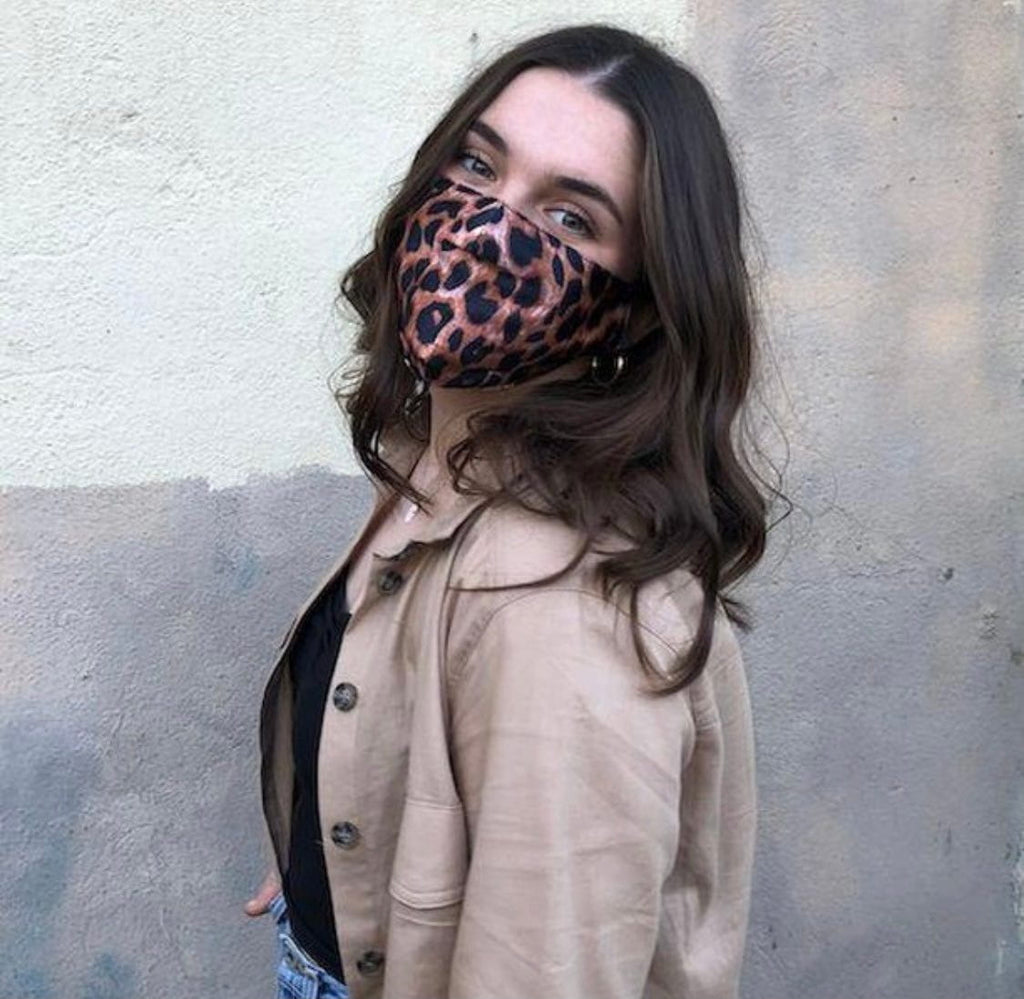 woman outside wearing leopard satin face mask
