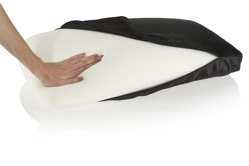 hand pressing on Night memory foam pillow while out of black pillowcase